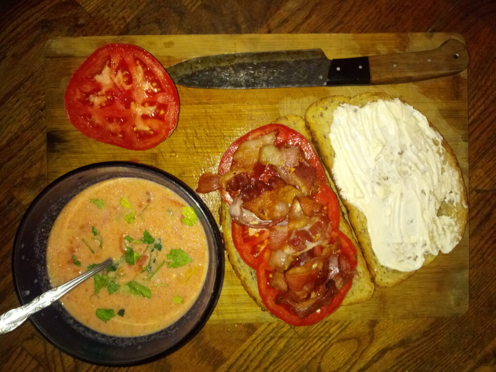 Tomato Bisk with Bacon and Herb Folded Cream Cheese Sandwich on Toasted Rye Bread